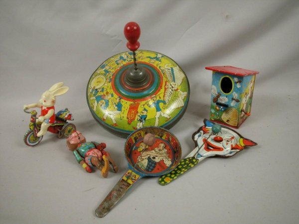 Group of tin lithograph toys - rabbit on tricycle
