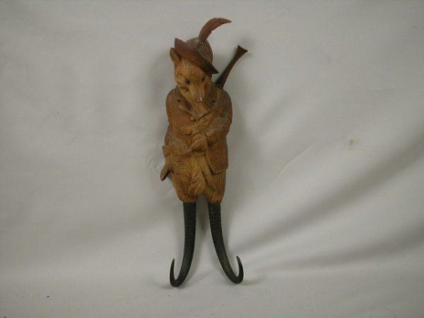 Black Forest wood carved fox hunter with gun coat