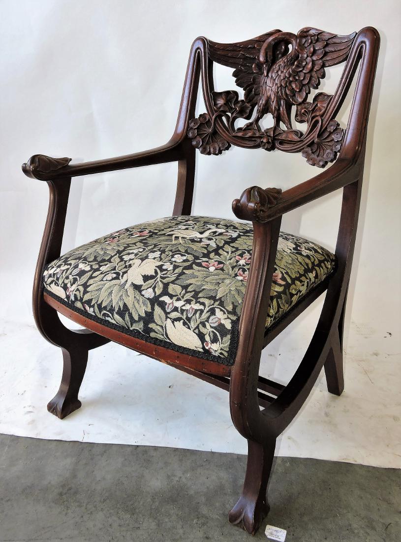 Mahogany armchair with swan carved: back
