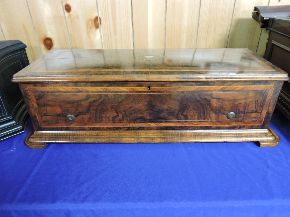 Longue Marche 13" cylinder music: box, 6 tune, burlwood case with MOP inlay, 29"w, 8 1/2", plays well, lacking hand crank