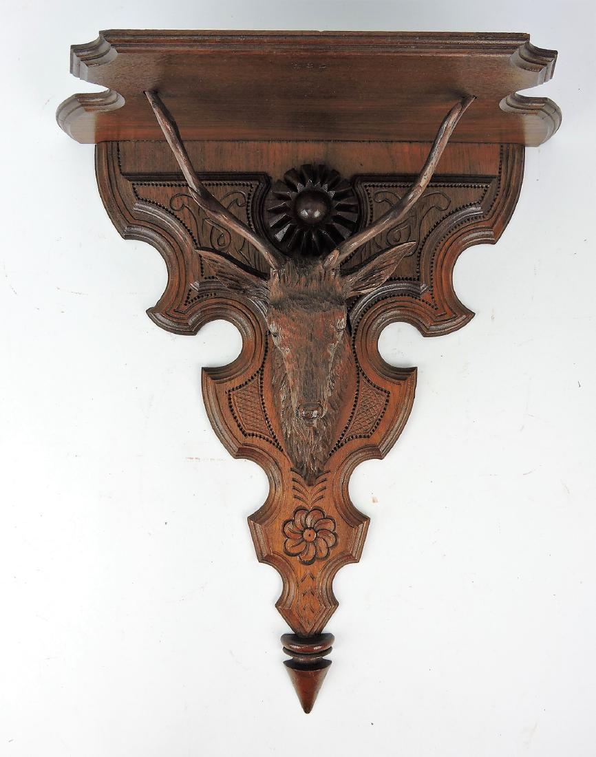 Walnut Victorian wall shelf with stag,
