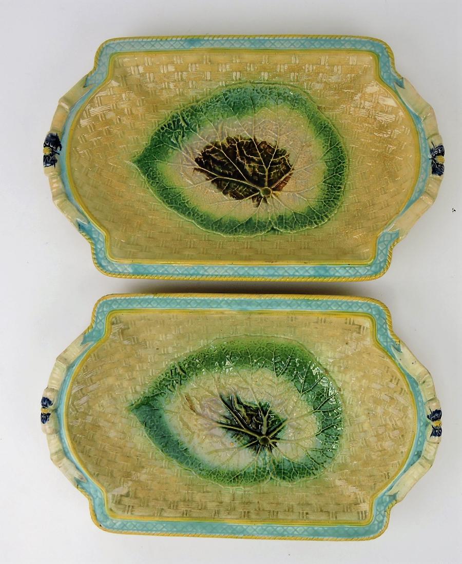 Majolica pair of begonia leaf on basket: platters with ribbon handles, various condition