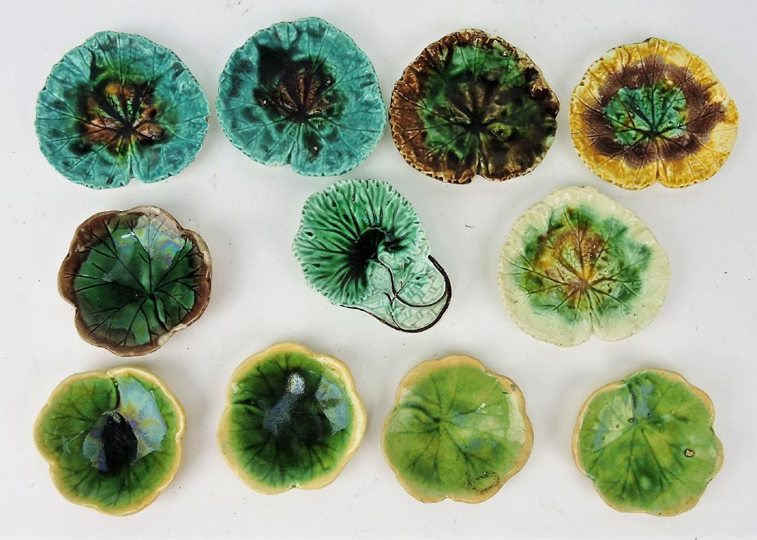 Majolica lot of 11 butter pats, various: condition