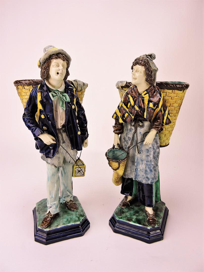 Hugo Lonitz majolica figures of man: and woman with back pack baskets, 13"