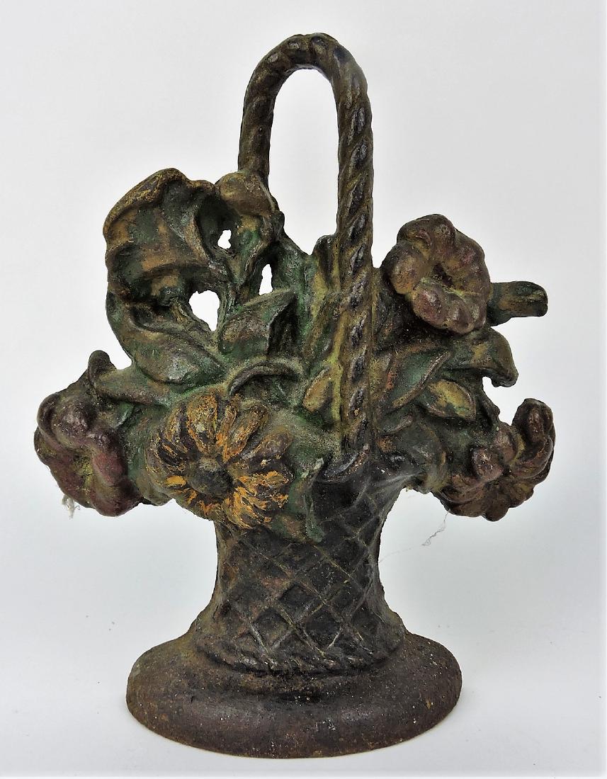 Cast iron flower basket doorstop,: 9 1/2"
