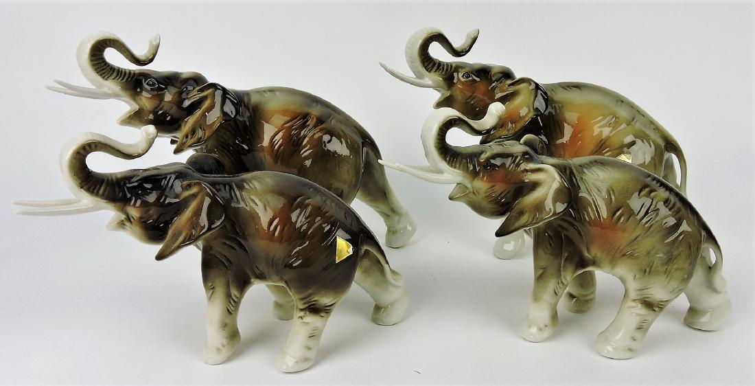 Royal Dux lot f 4 elephants,: 2 - 8" (one with tusk repair), and 2 - 6"