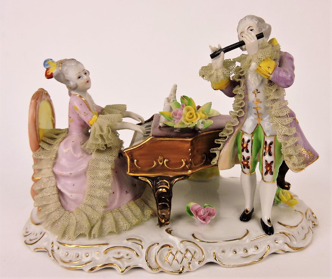 Dresden type figure with lady at: piano and man with flute, some losses, 6"