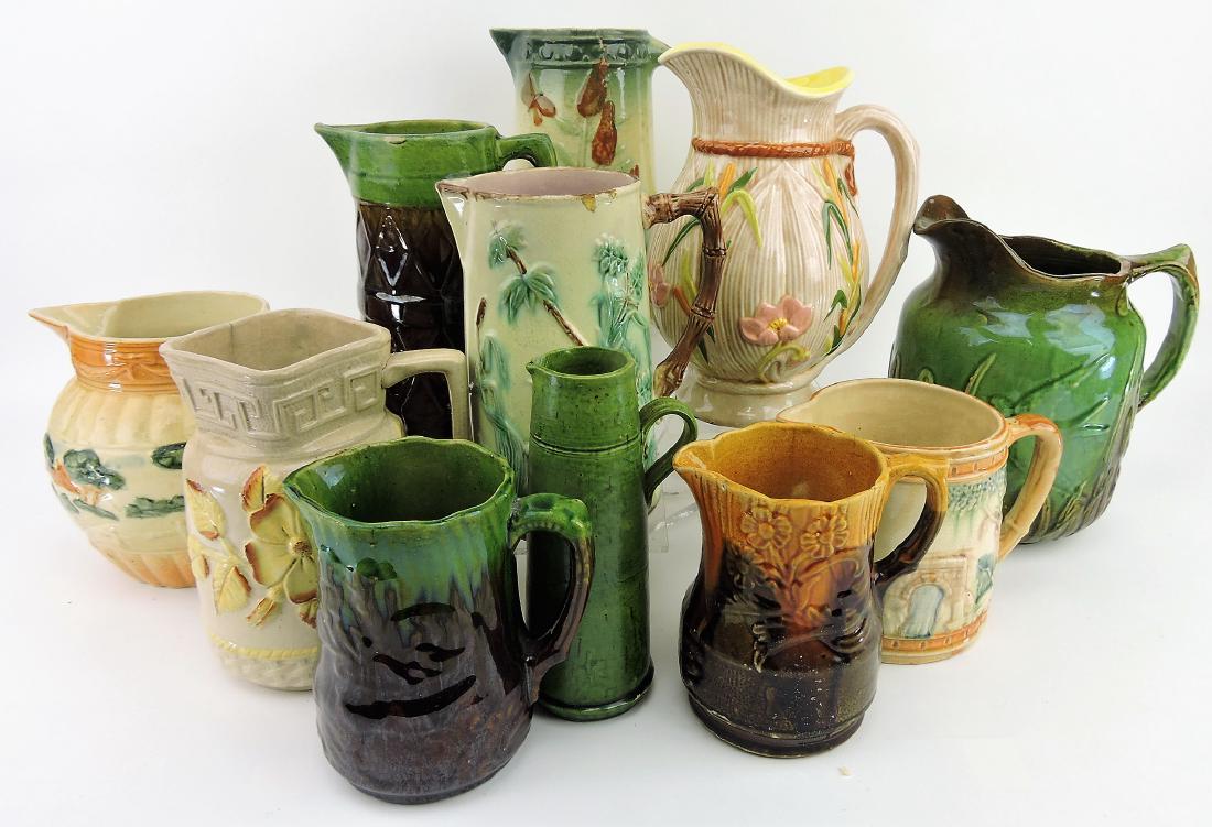 Majolica lot of 11 pitchers, various: pitchers