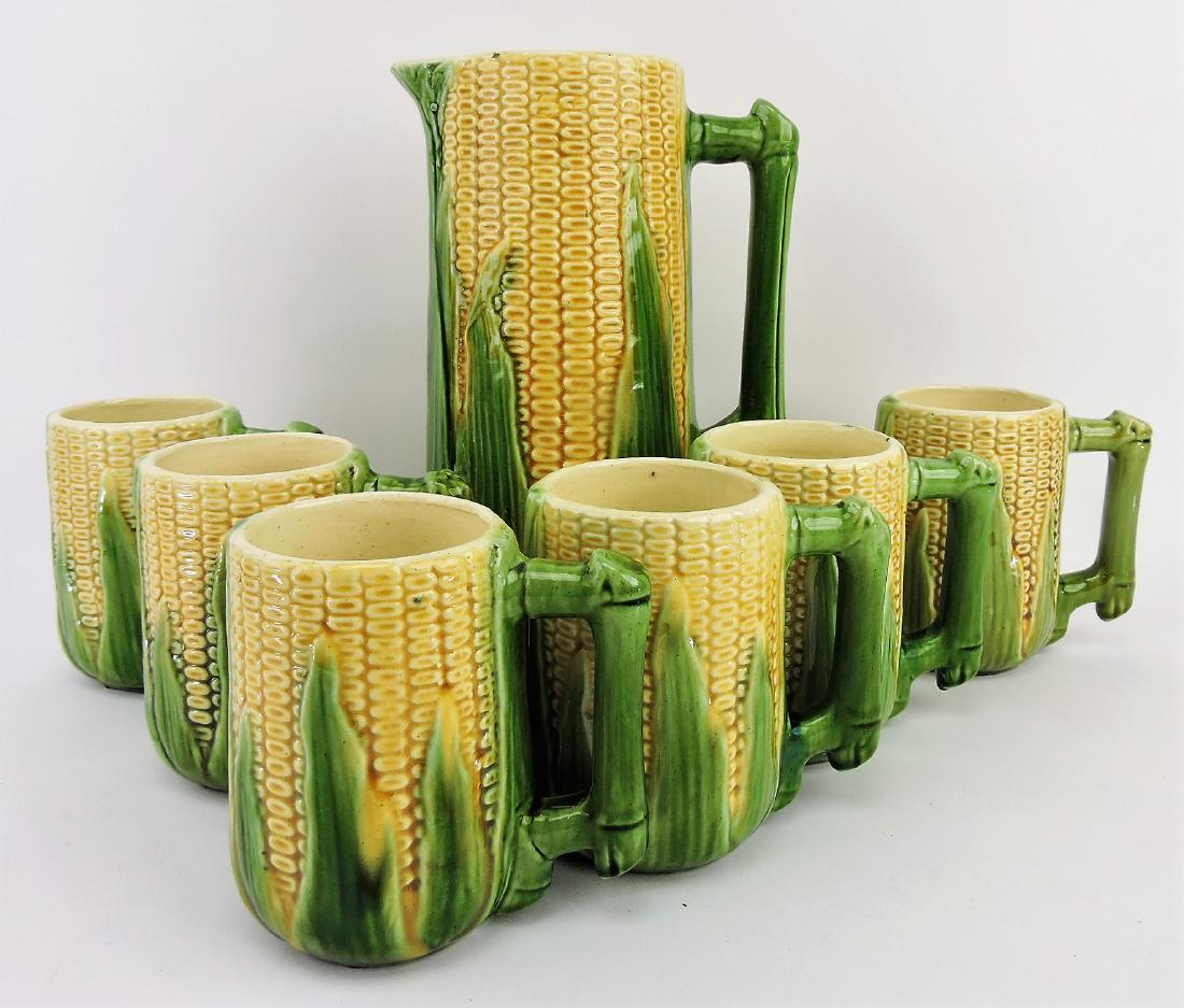 Majolica corn tankard, 12 1/2", and: 6 - 6" mugs, various condition