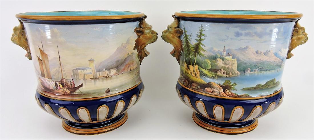 Minton rare pair of wine coolers: with lion head mask handles, each hand painted with country and lakeview scenes, attributed to John Thorley, 8"