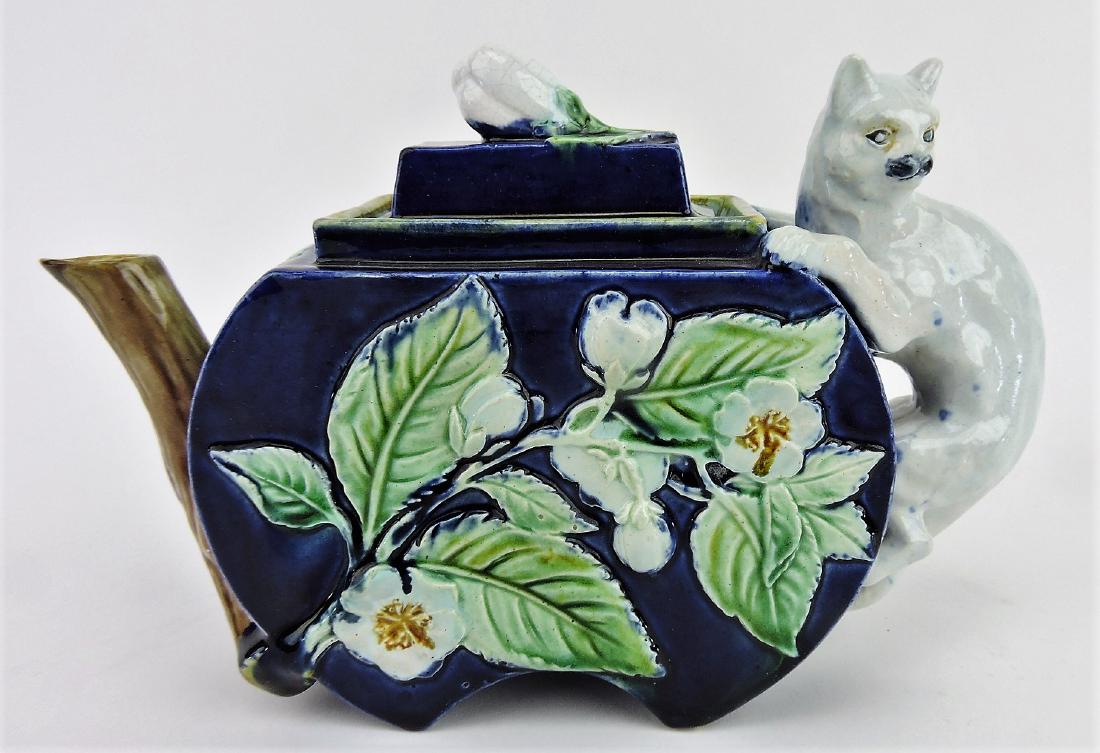 Majolica cobalt floral teapot with: cat handle, branch spout, and flower finial, 6"h, 9"w, professional repair to spout and lid rim