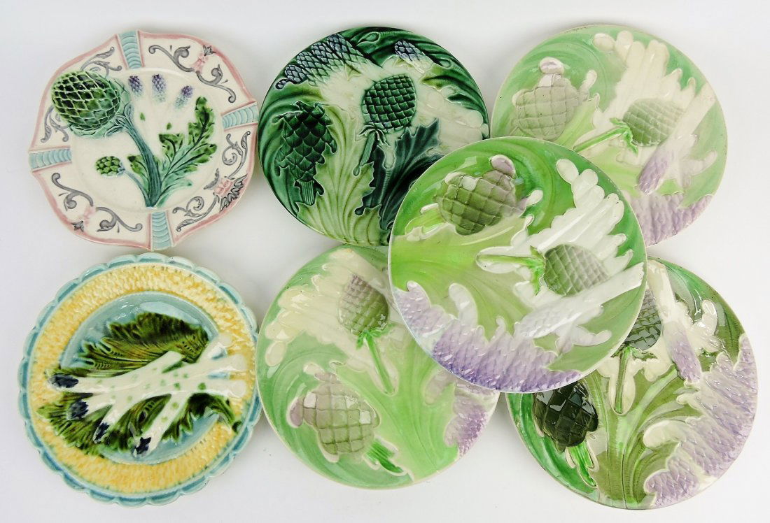 Majolica lot of 7 asparagus and: artichoke plates, various condition