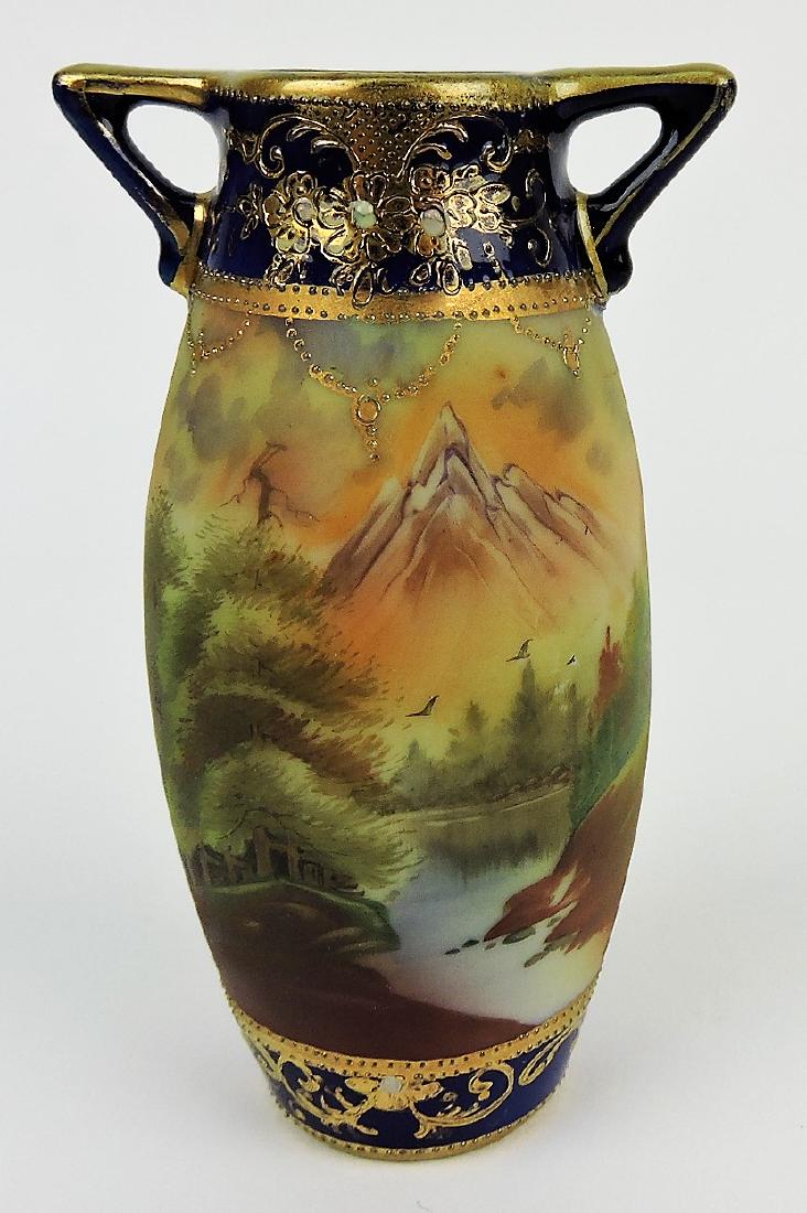 Nippon cobalt 5" two handled vase: with mountain/river scene, heavy gold, and enamel beading, professional rim repair
