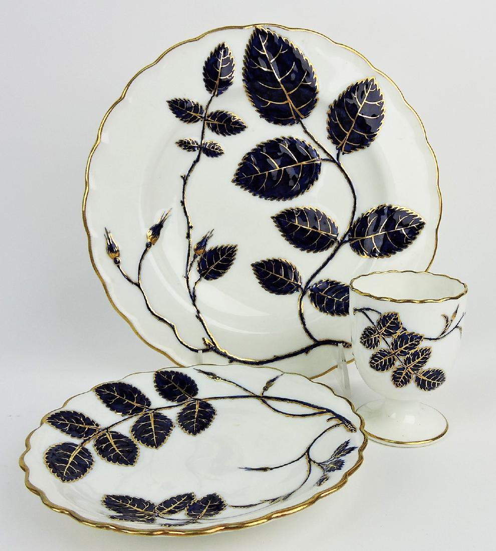 Minton fine porcelain group; 9 1/4": plate, egg cup, and under plate, each with cobalt/gold leaf design
