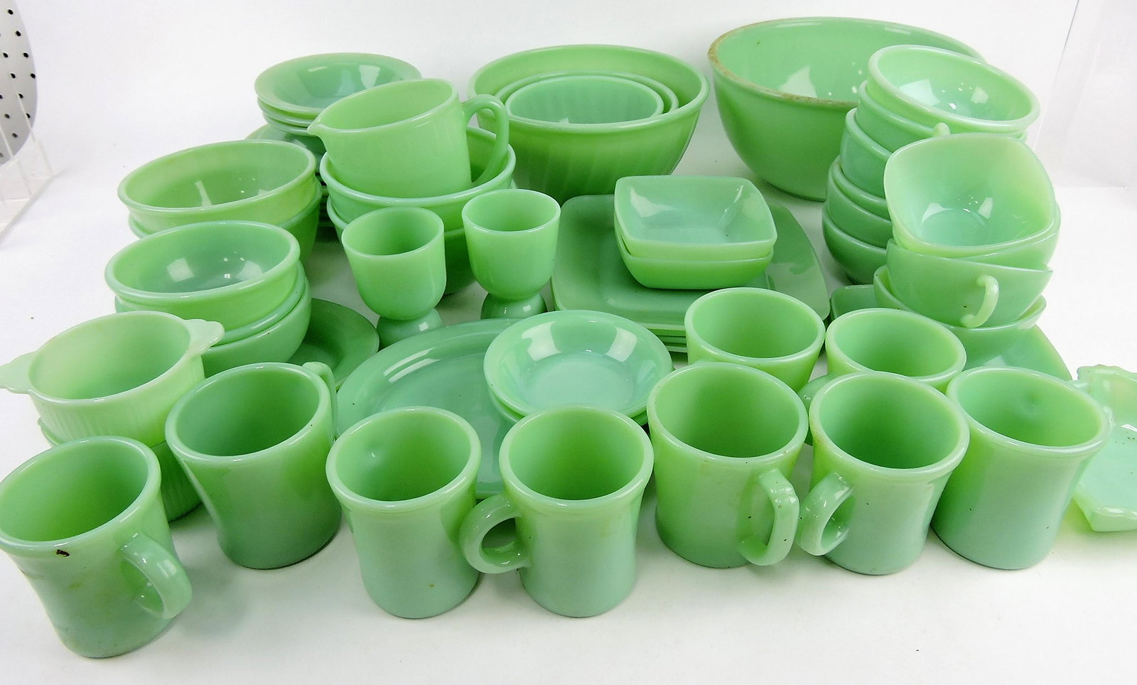 Fire King jadeite lot of 61 pieces;: plates, bowls, cups, saucers, and more