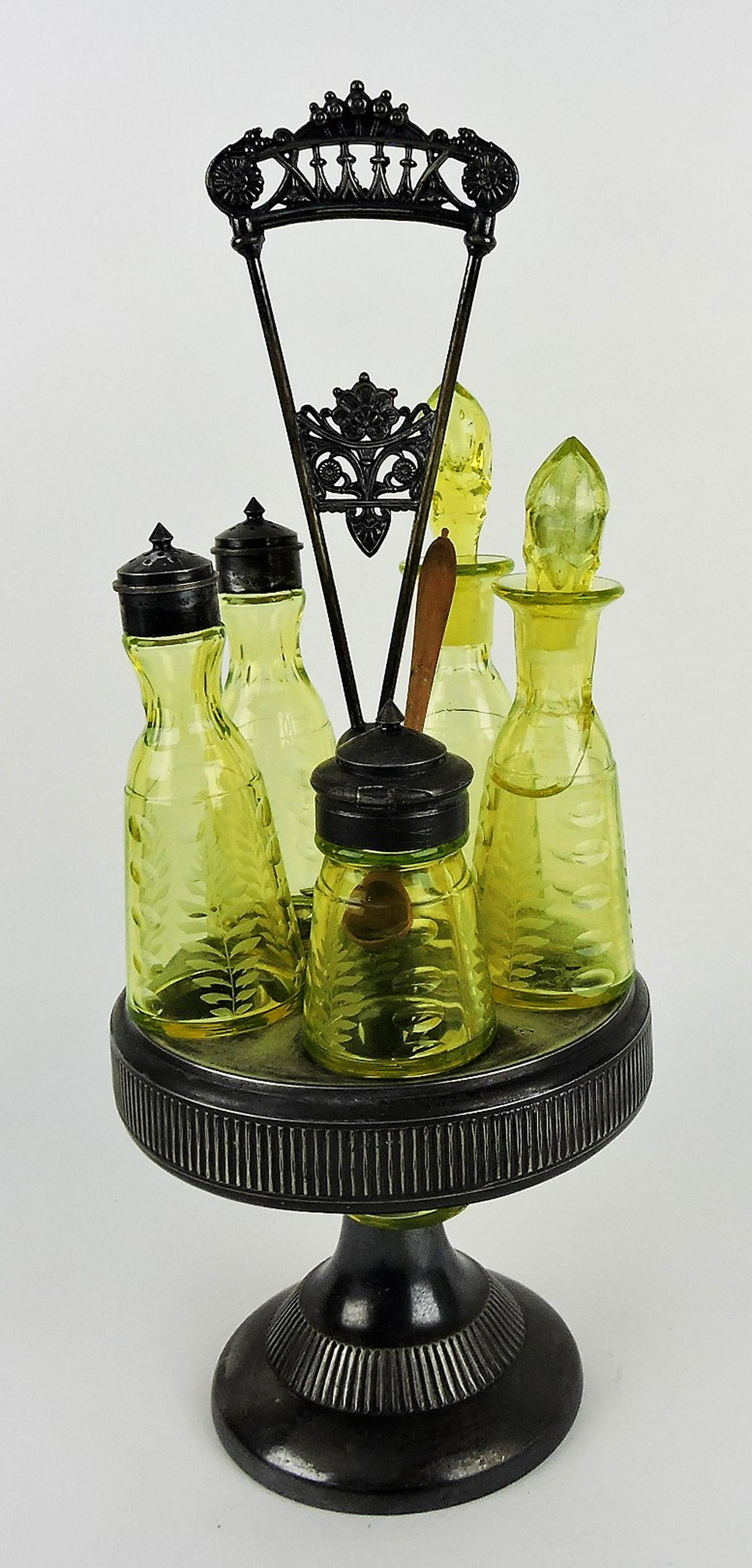 Vaseline glass five bottle castor set,: damage to one bottle and stopper