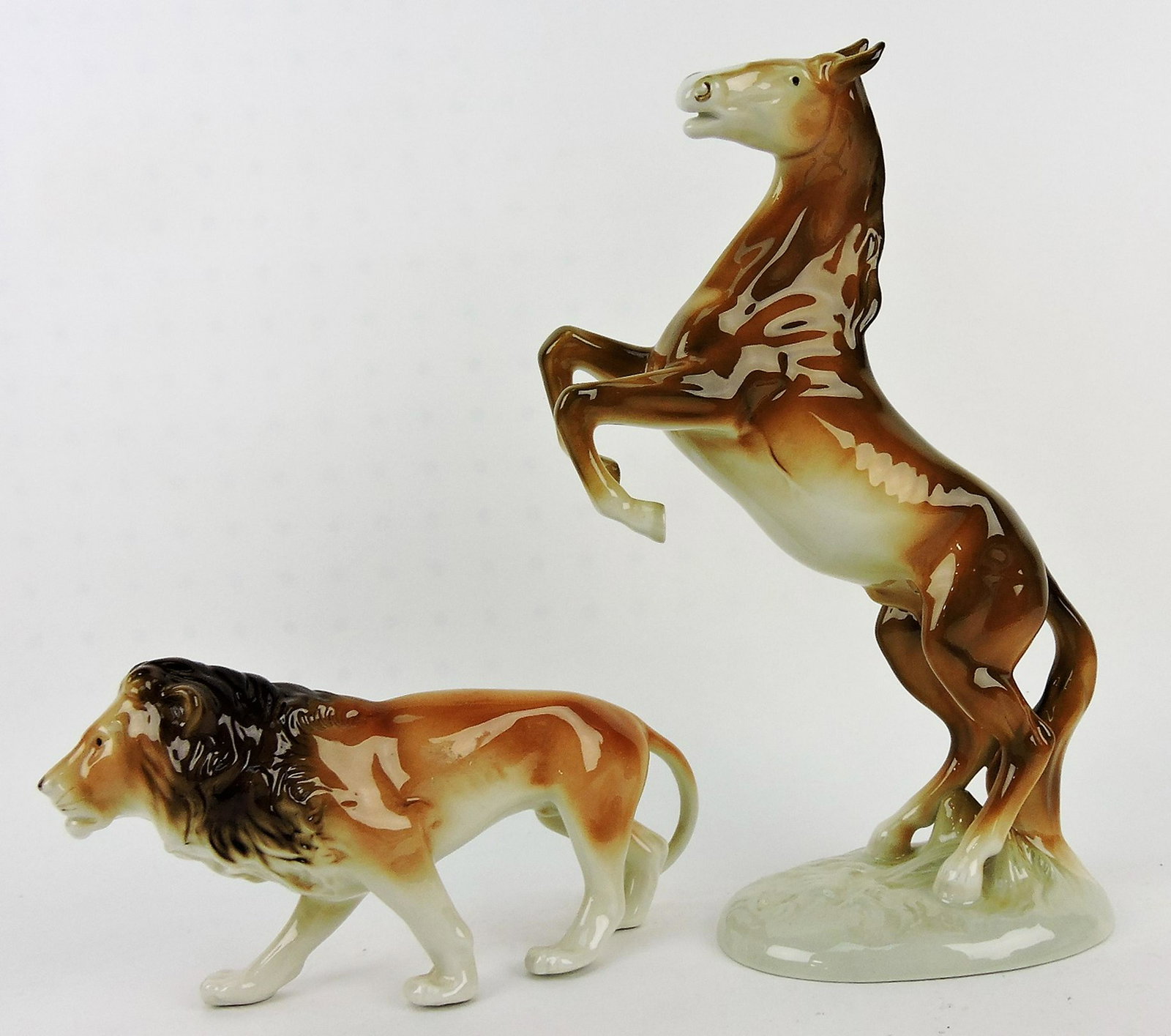 Royal Dux lion (9" l), and rearing: horse (12" h)