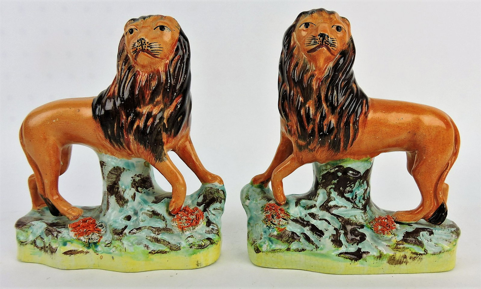 Staffordshire rare pair of lion figures,: 6 1/2"