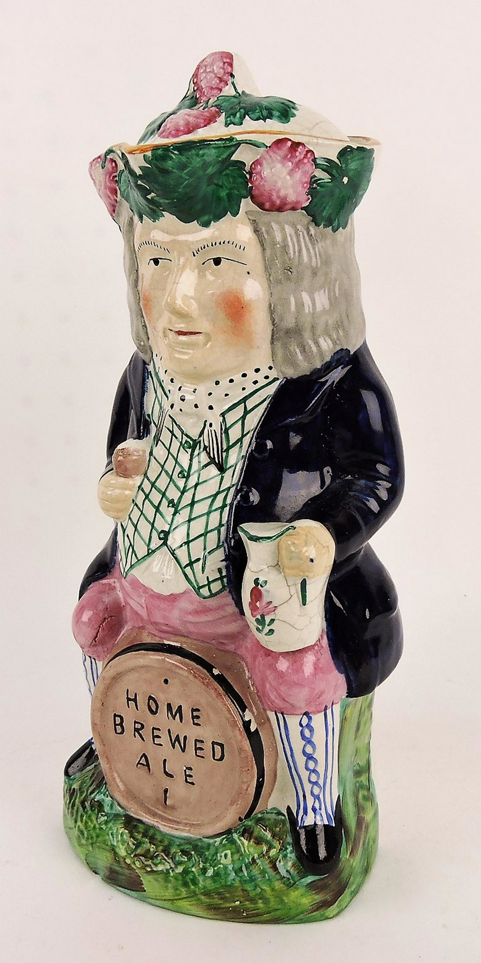 Staffordshire "Home Brewed Ale": covered toby jug, 13"