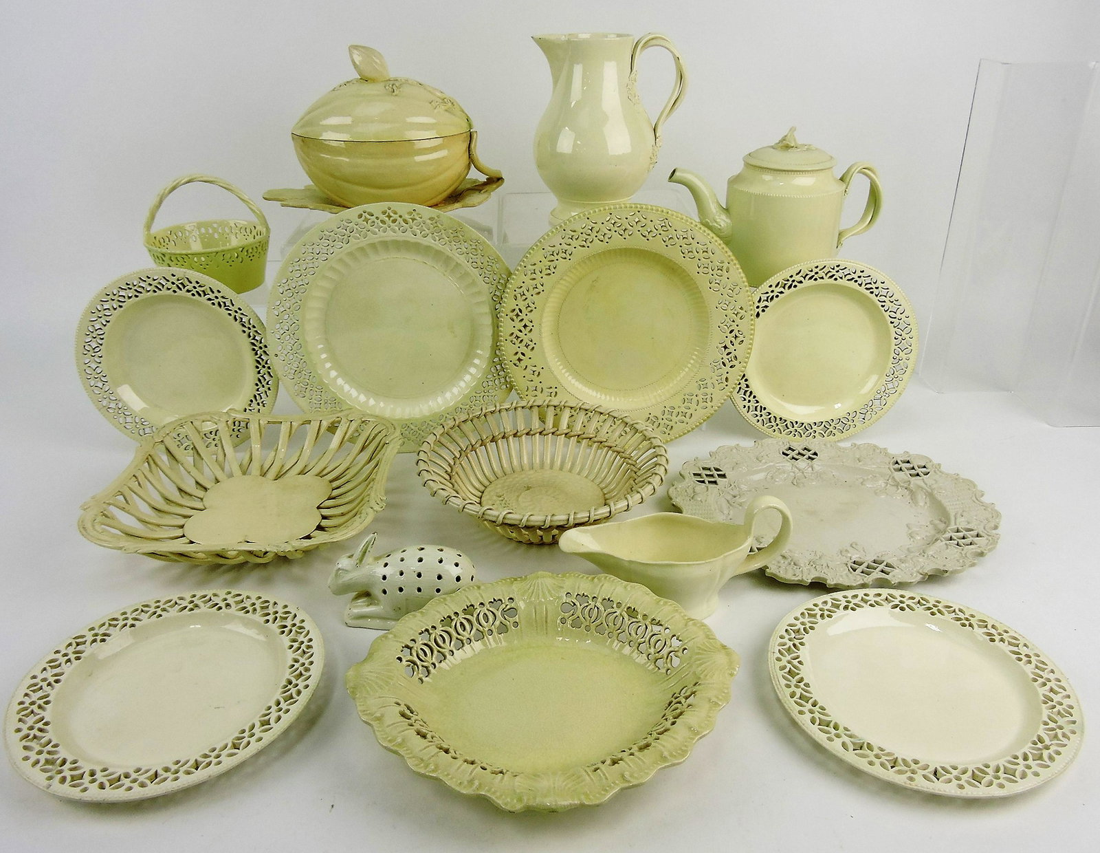 Creamware lot of 16 pieces; basket,: teapot, squash tureen, pitcher, plates, trays, various condition