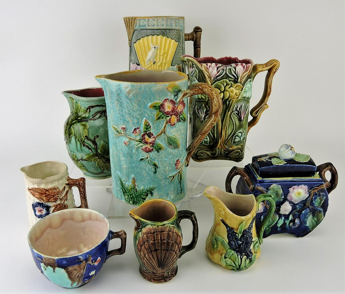 Majolica group of 9 pieces;: 7 pitchers, sugar, cup, various condition