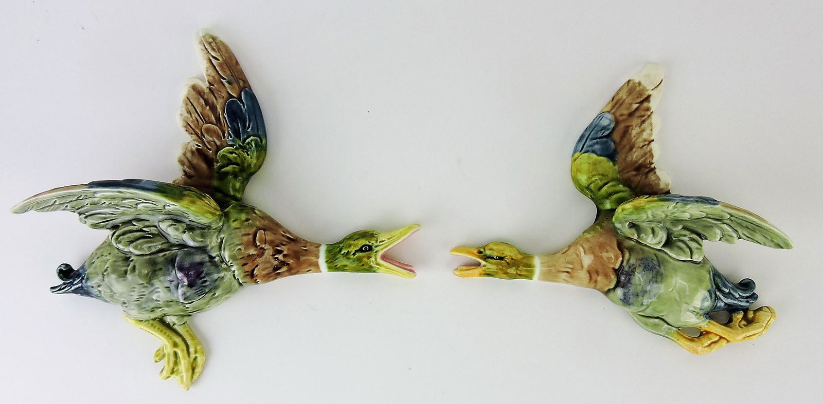 Royal Dux (attributed) pair of Majolica: flying duck wall pockets, 9" & 7 1/2"