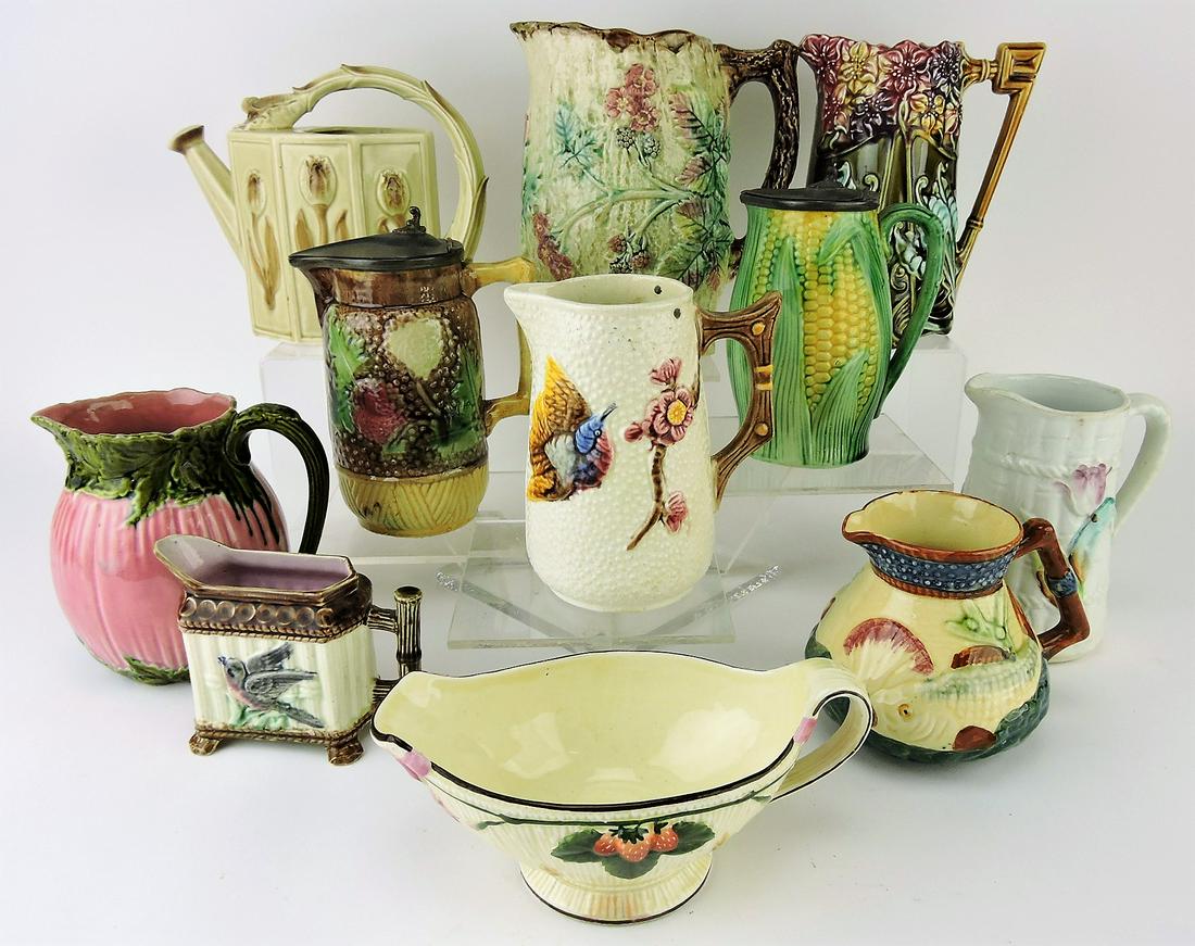 Majolica lot of 11 pitchers, various: condition