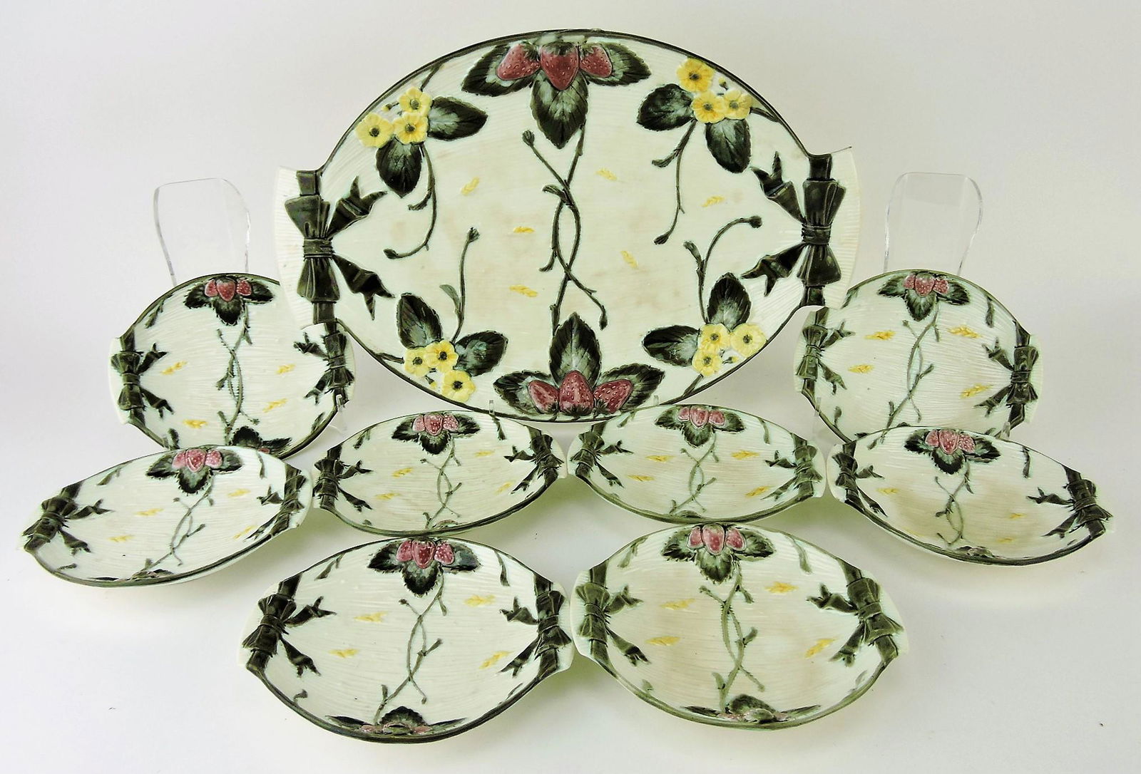 Wedgwood majolica Argenta 9 piece: strawberry service, 16 1/2" platter and 8 - 6 1/2" berry dishes, minor staining, nick to one berry dish