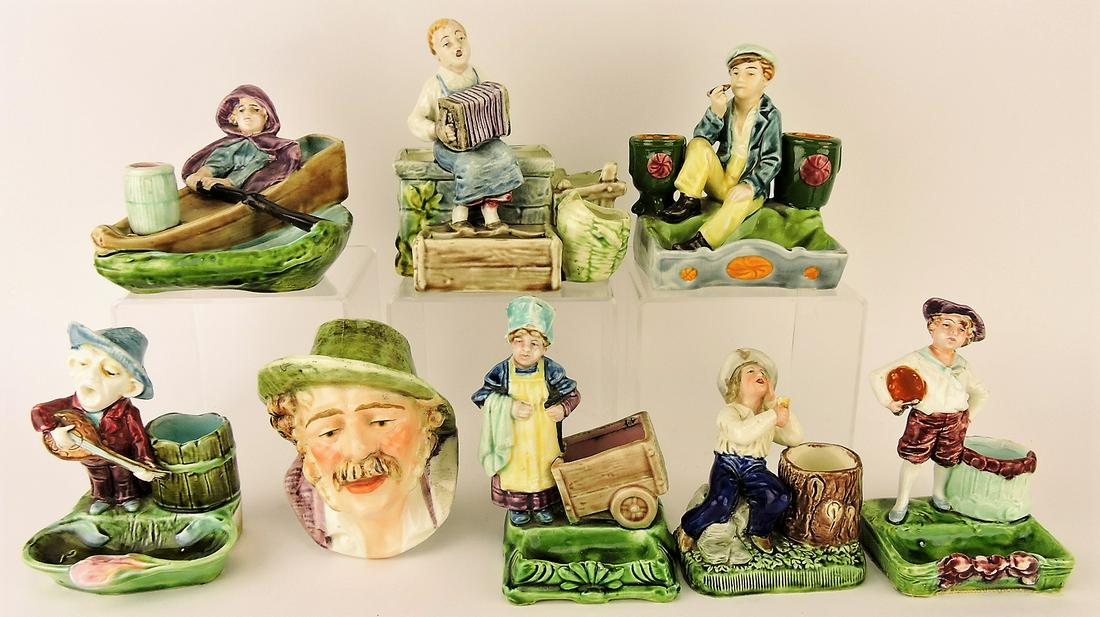 Majolica lot of 8 figural match strikers,: various condition