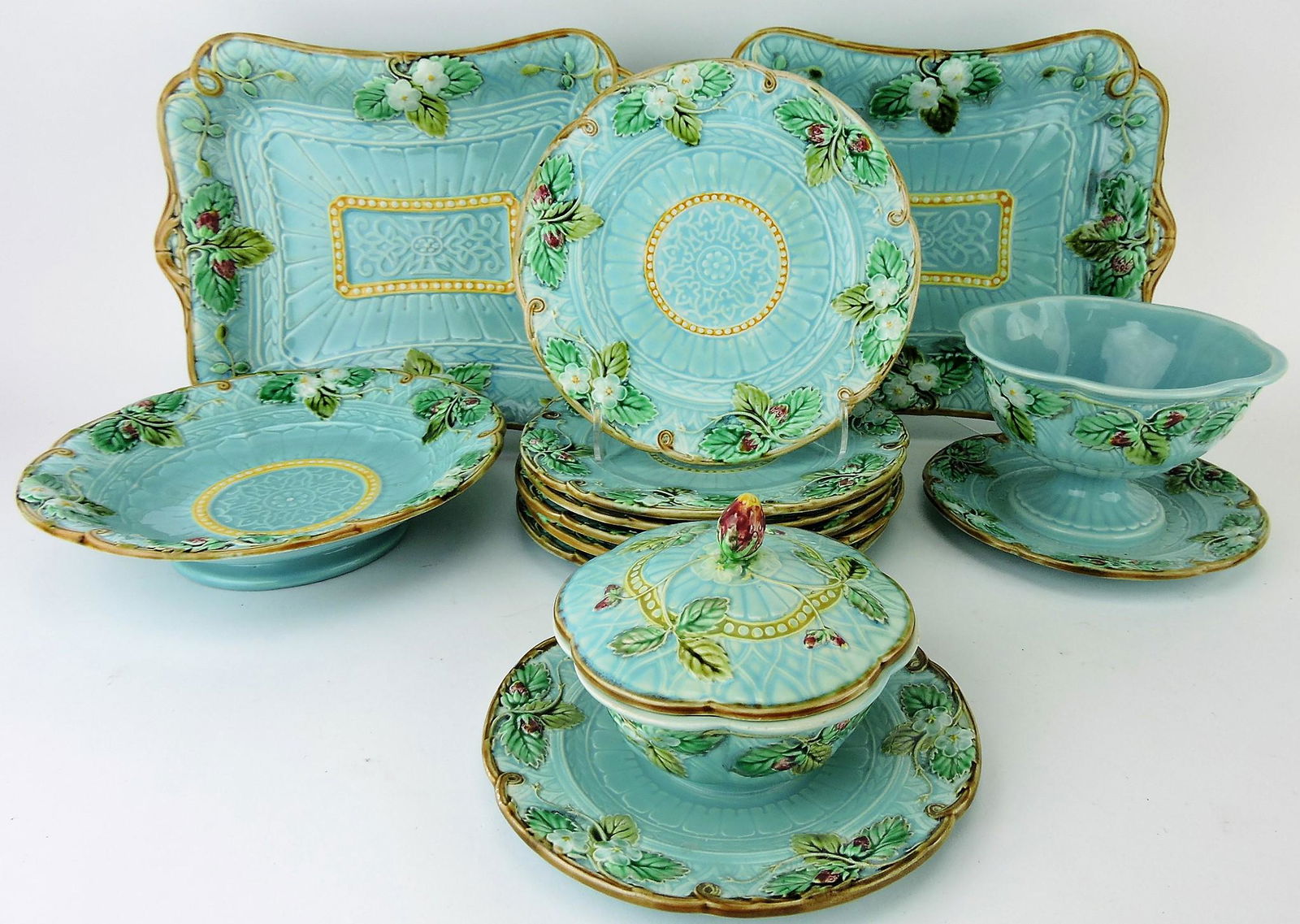 Sarreguemines majolica turquoise: strawberry 11 piece dessert set, 2 - 12 1/2" platters, 9 1/2" low compote, 6 - 8" plates, 6 1/2" compote, and covered butter dish