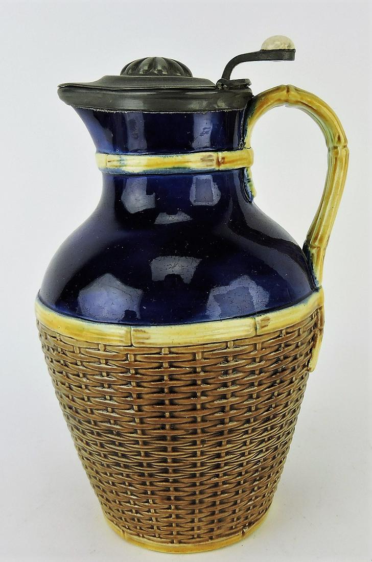 George Jones majolica cobalt and: wicker pitcher with pewter top