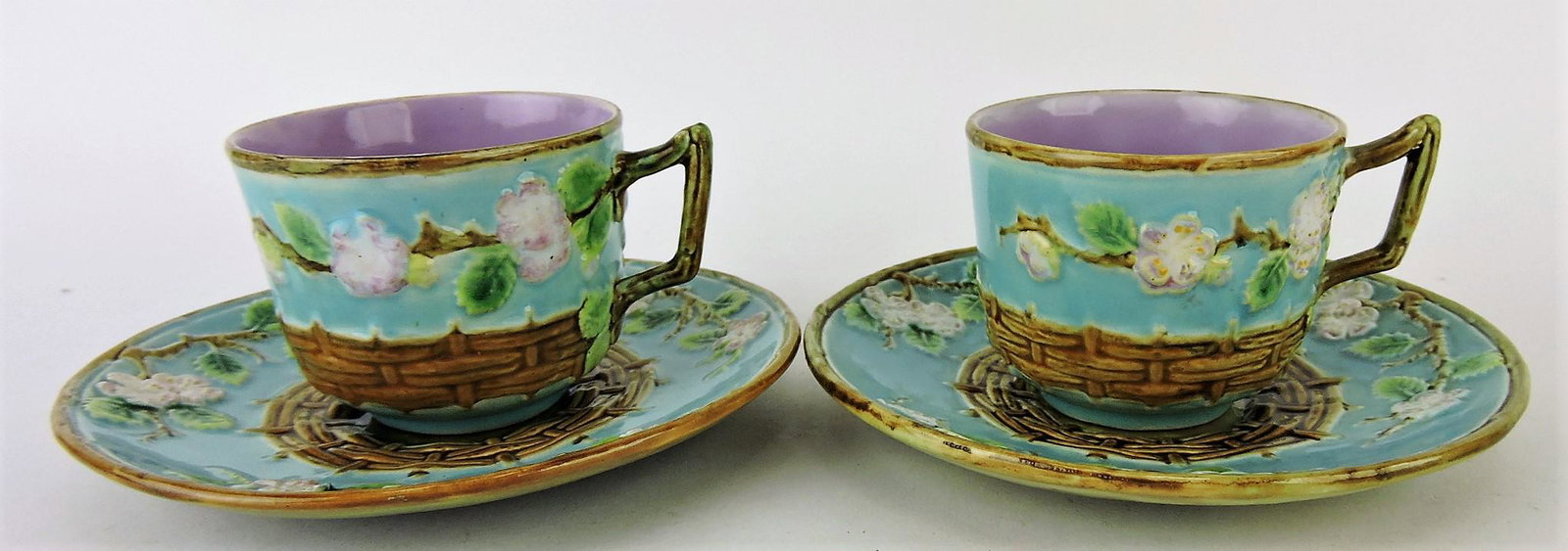 George Jones majolica pair of: apple blossom and wicker cups and saucers