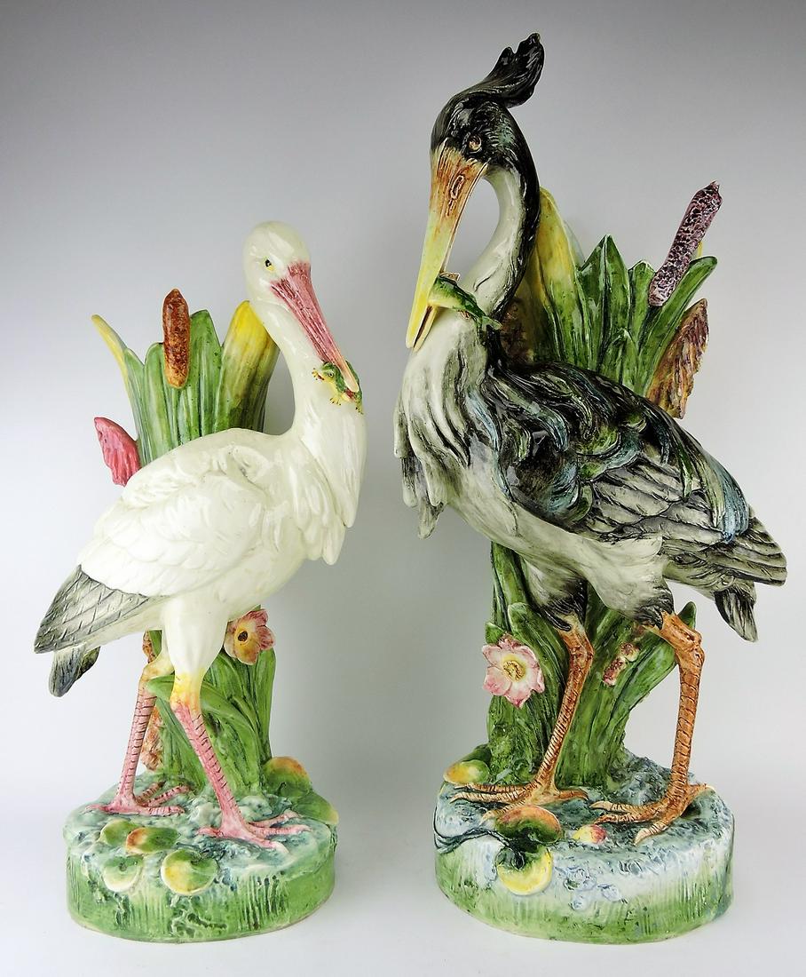 Royal Dux majolica pair of stork: and heron walking stick stands, 25" stork holding frog in it's beak and 31" heron with fish in it's beak