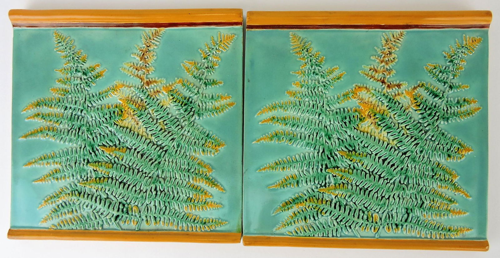 George Jones majolica pair of: 8" tiles with ferns, professional surface repair