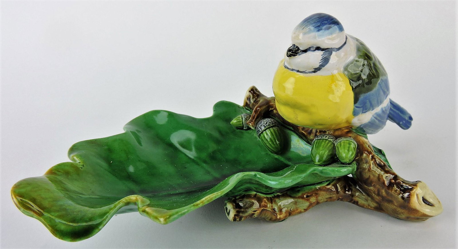 Minton majolica bird on oak leaf: dish with acorns, professional rim repair to leaf, 8"