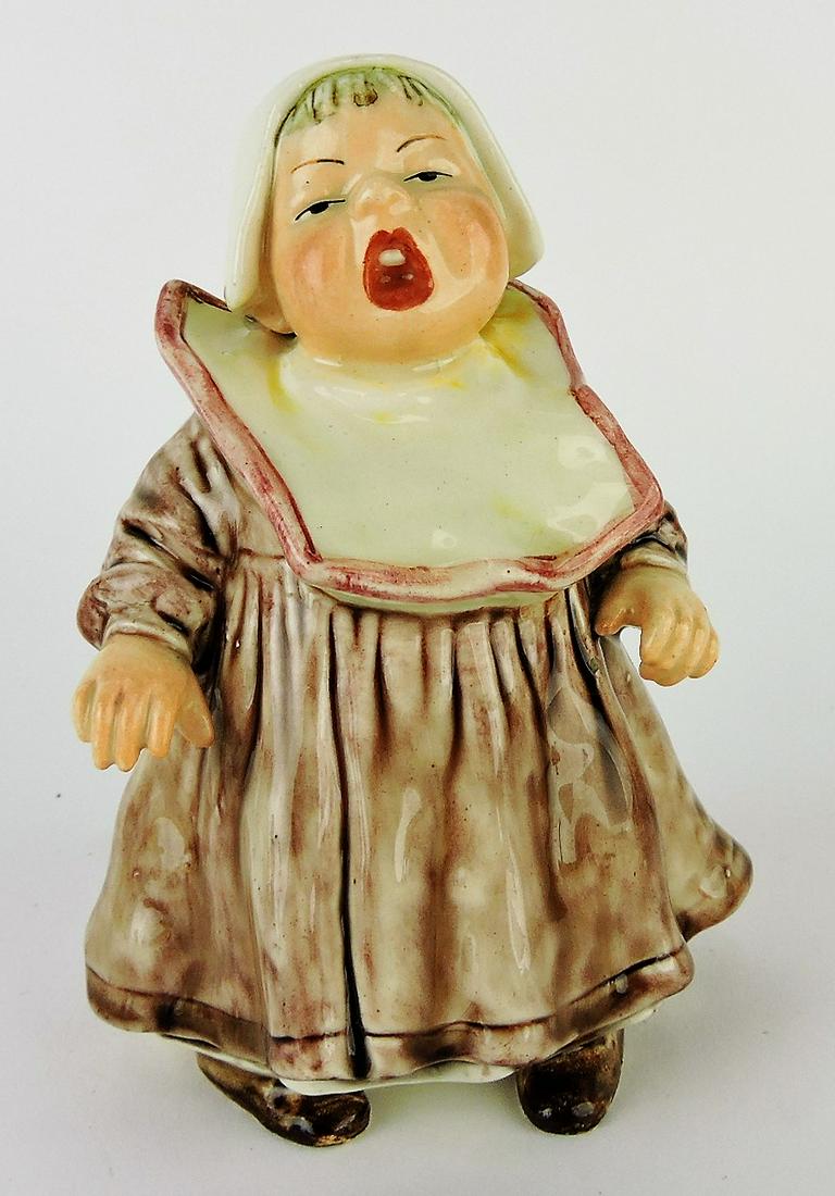 Majolica rare money bank of standing: crying child with bib, 5 1/2"