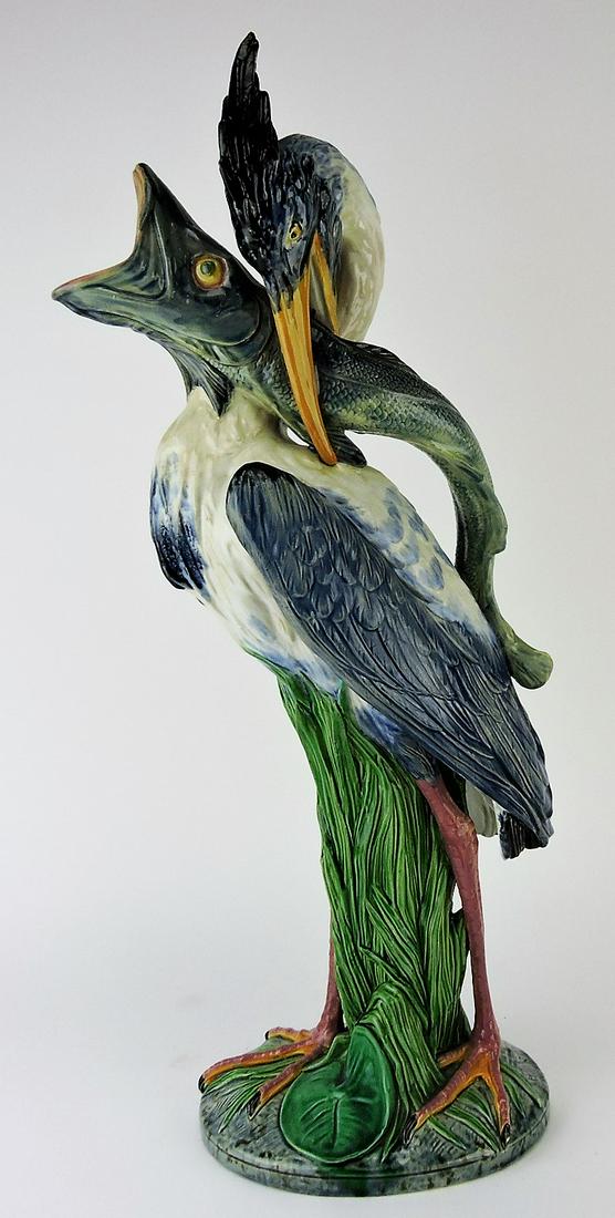 Minton majolica stork and fish: figural ewer designed by Hughes Protat, shape no. 1241, 22", professional repair to fish's mouth