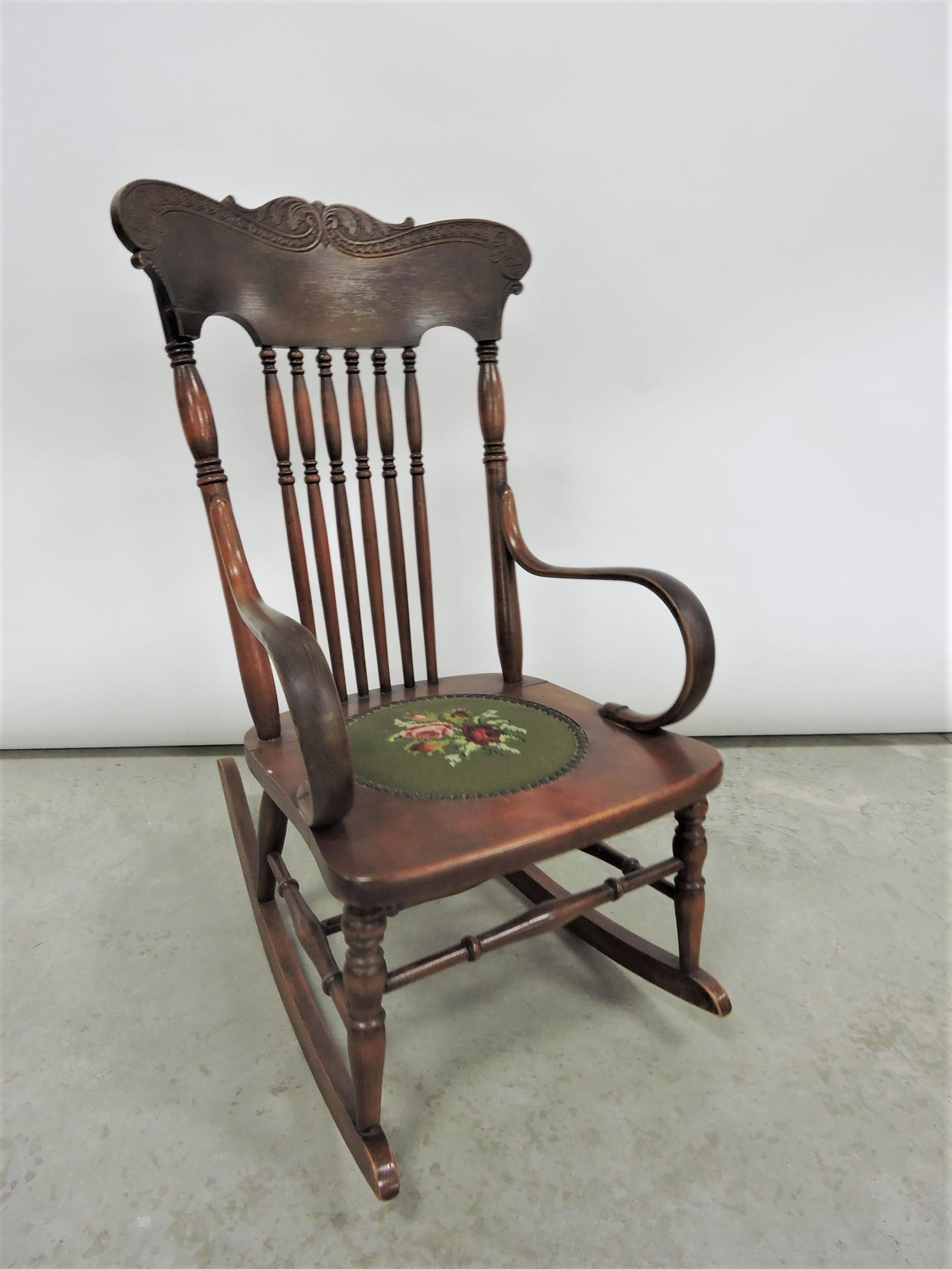 Mahogany print back rocker with needle: point seat