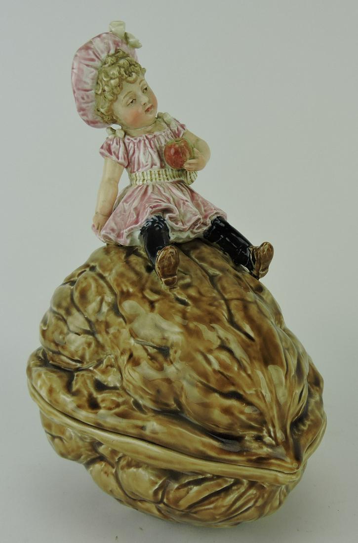 Majolica walnut tureen with girl: holding an apple, 11"