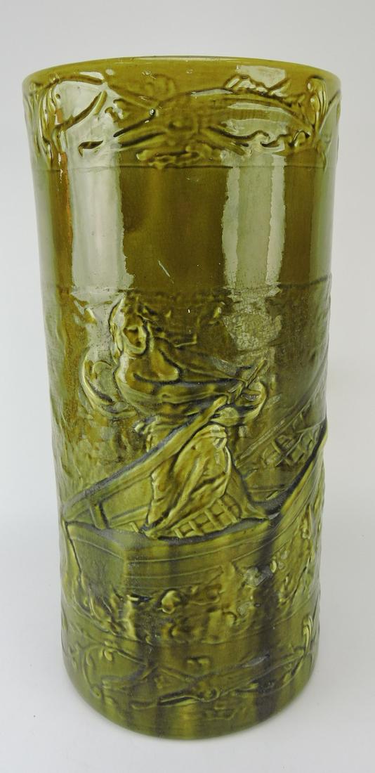 Majolica umbrella stand with lady: in boat in relief, 21"