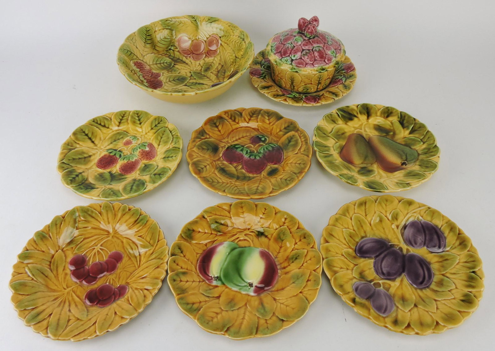 Sarreguemines majolica 8 piece: fruit set; covered butter dish, 9 1/2" bowl. and 6 - 7 1/2" plates, various condition