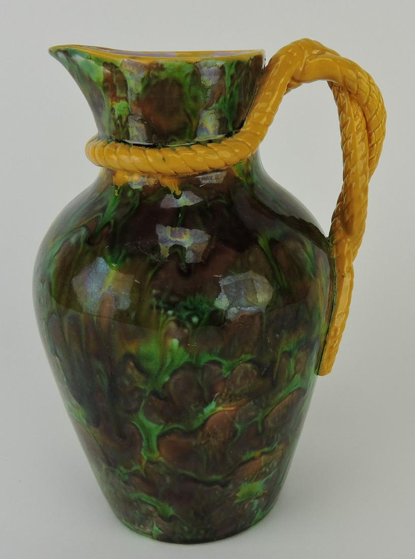 George Jones mottled majolica: pitcher with rope handle and pewter top, 8"