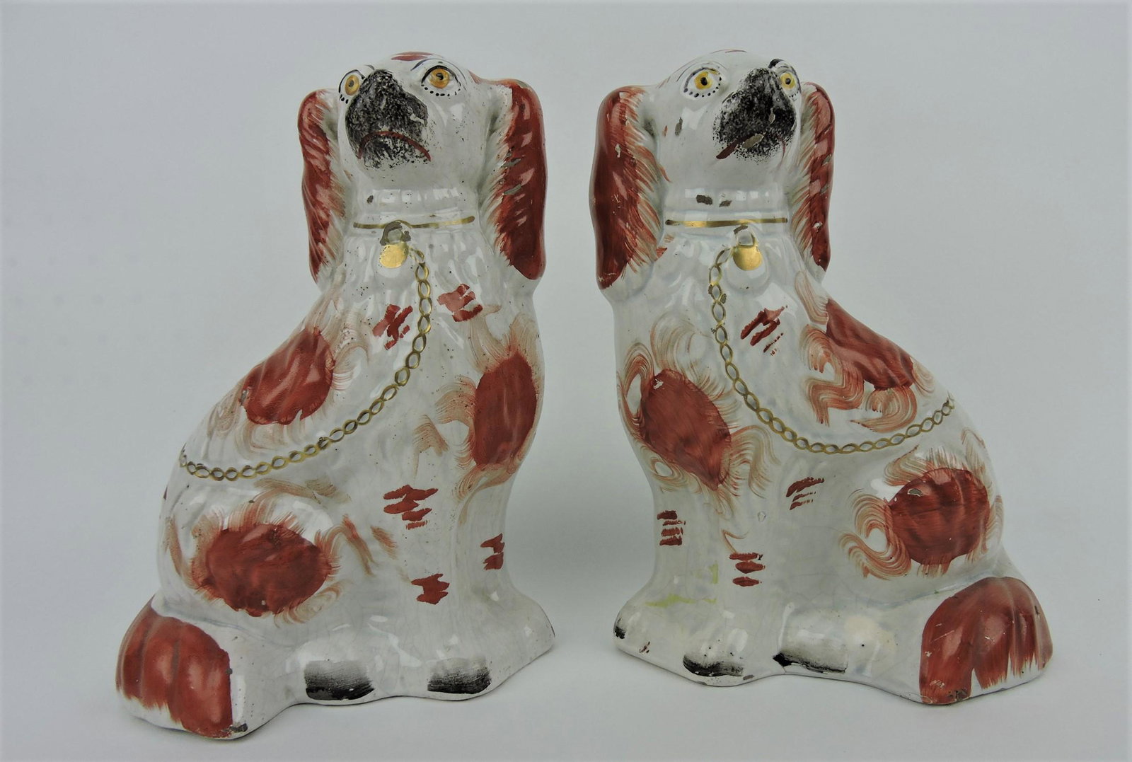 Staffordshire pair of russet and white: spaniels, 10", minor wear