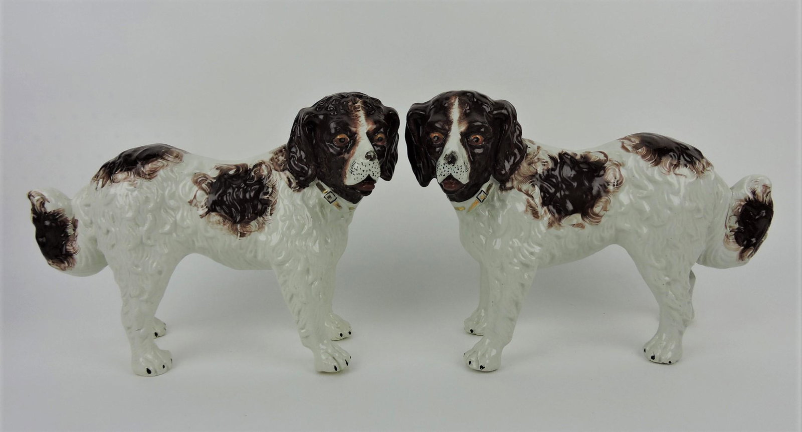 Staffordshire pair of large St. Bernards,: 10"h, 13"l, repair to bottom of ear of left dog