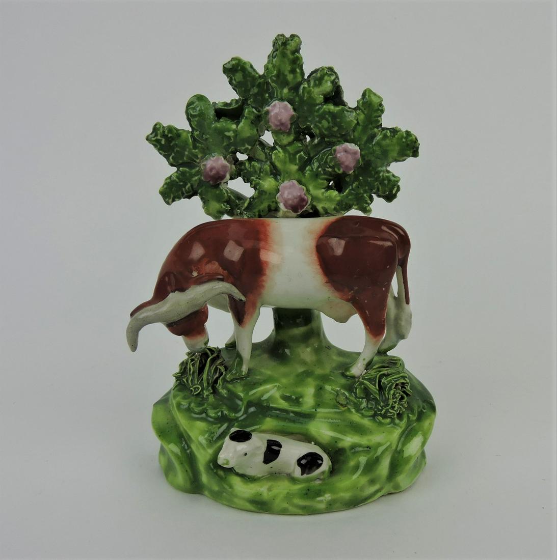 Staffordshire Pearlware cow and calf: bocage figure, 6"
