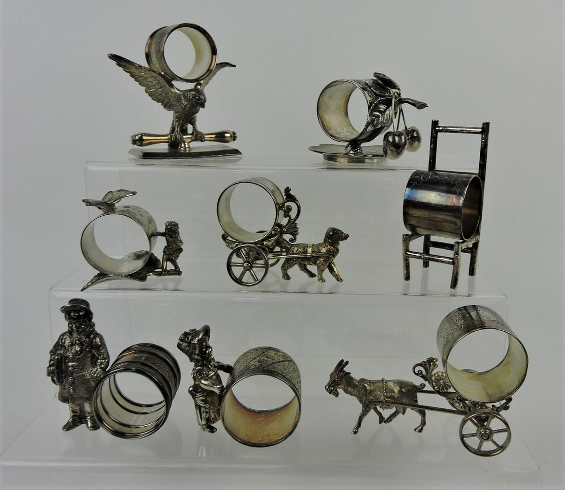 Silver plate lot of 8 figural napkin rings: .