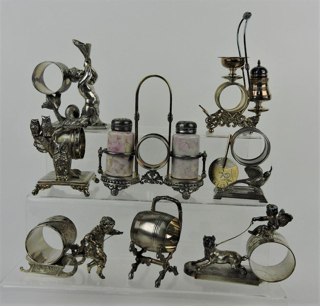 Silver plate lot of 8 figural napkin rings: .