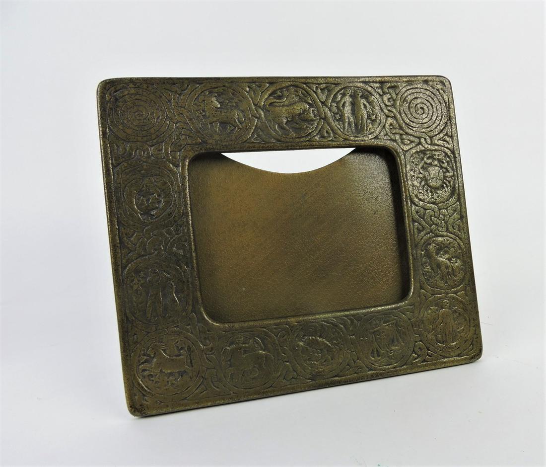 Tiffany Studios, New York, Zodiac bronze: desk picture frame, 8"x7"