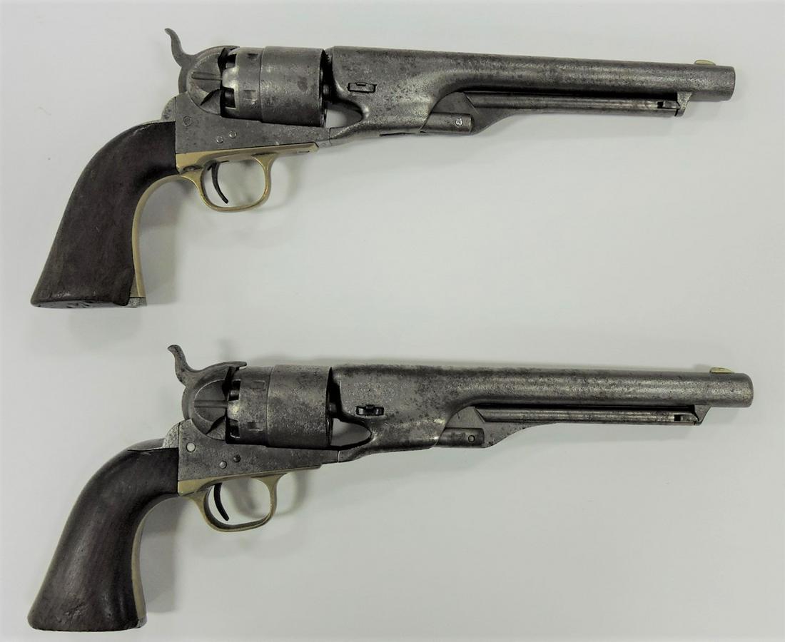 Pair of Colt's Patent .44 caliber black: powder Civil War revolvers, SN 118795 and 47769, butt plate on one with chip to corner, both show pitting, 13 1/2"