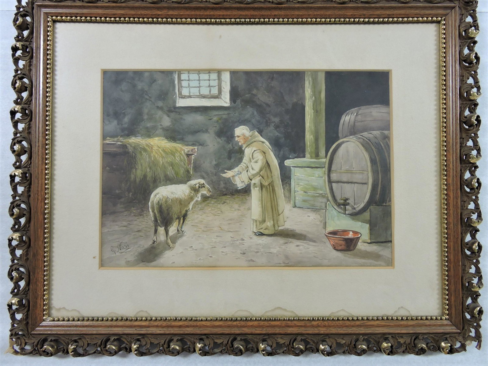 Watercolor of monk feeding a sheep: in barn, signed G. Nasi, 14"x20"